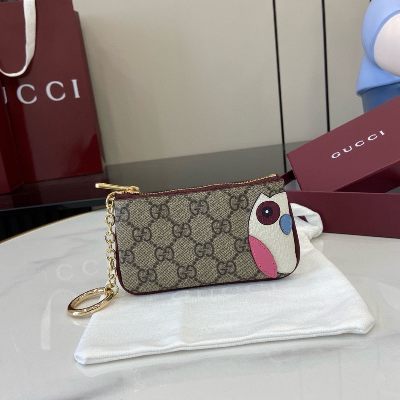 G*u*i clutch bags